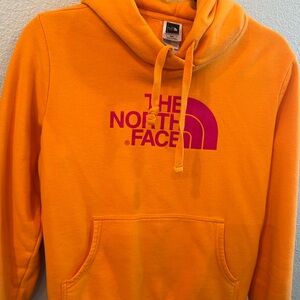The North Face Women’s orange hoodie.